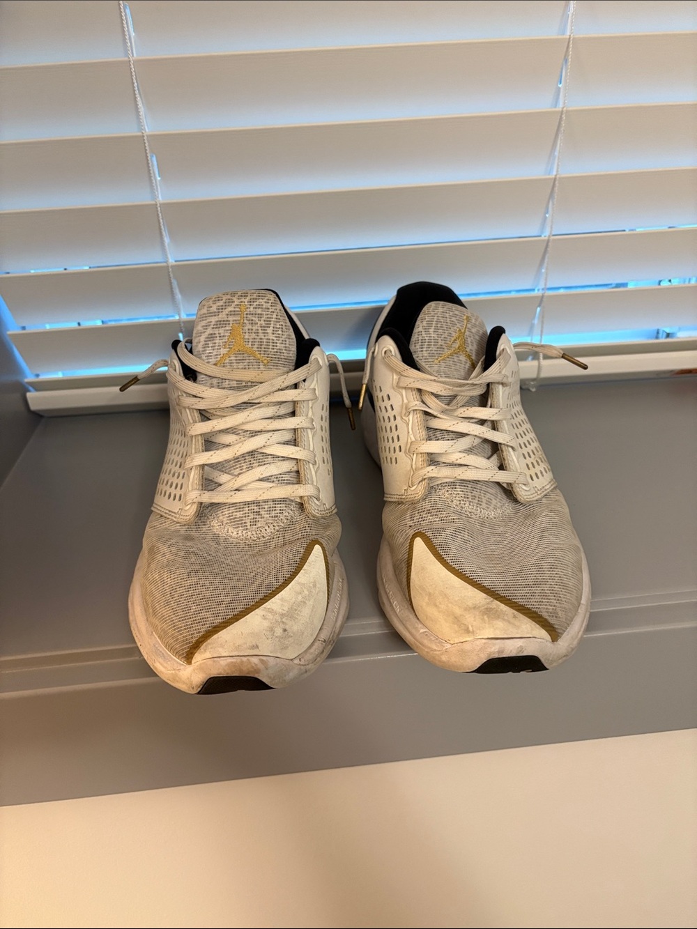 Jordan Men's White Athletic Shoes with Gold Accents